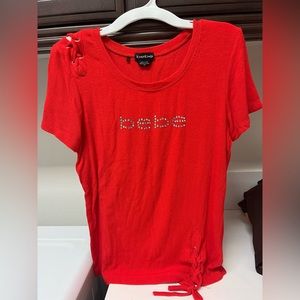 Women’s red orange shirt fitted.